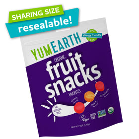 YumEarth fruit snack pouches open to reveal colorful bite-sized pieces.