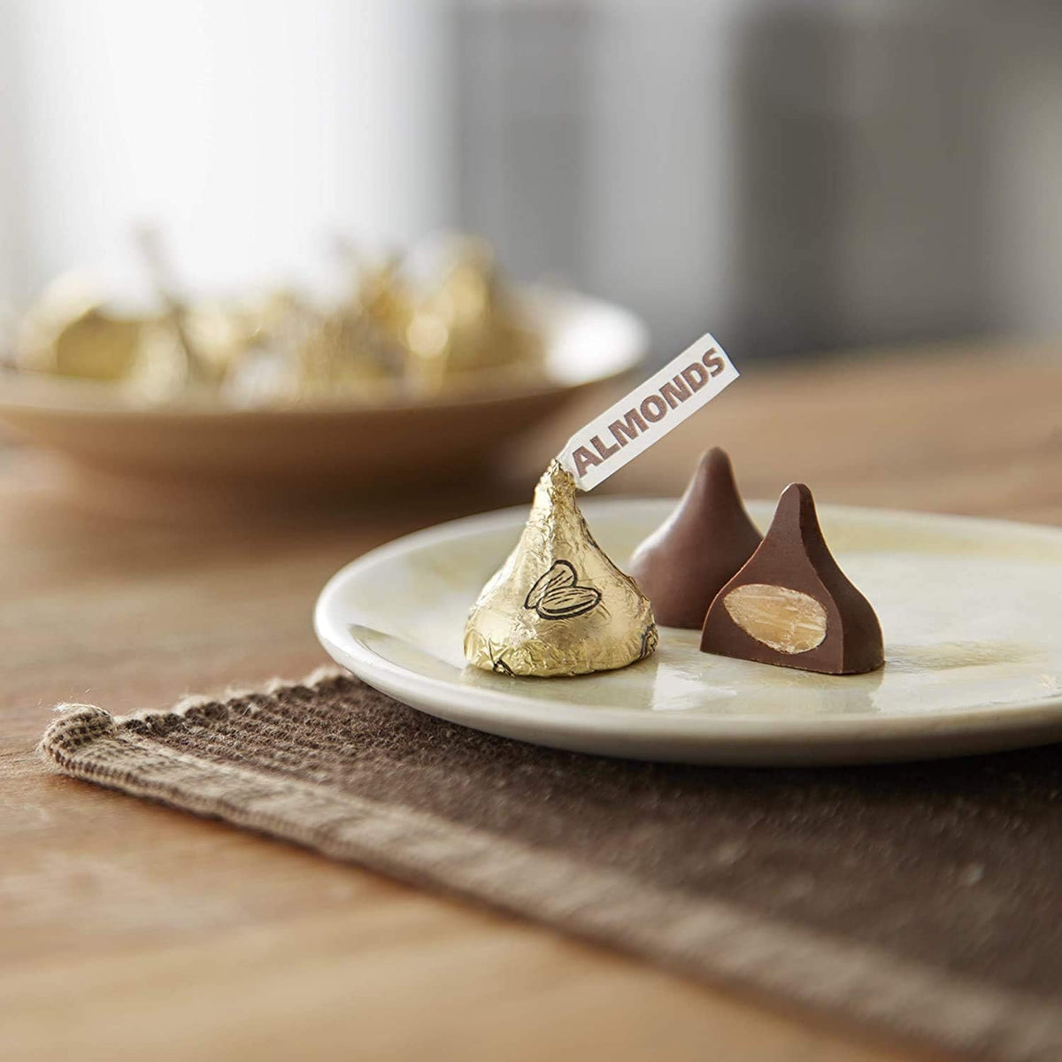 Yummy Chew Kisses with Almonds foil-wrapped candy close-up highlighting freshness and sharing.