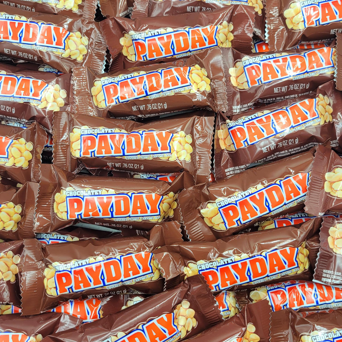 Yummy Chew PayDay chocolate peanut caramel closeup showing creamy chocolate with crunchy peanuts.