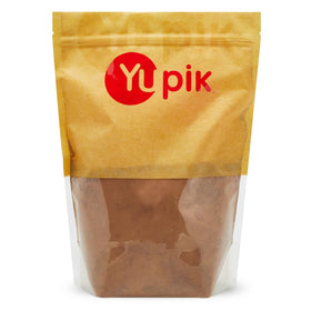 Yupik alkalized cocoa powder packaging close-up for rich baking flavors.