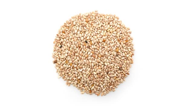 Close-up of Yupik chia seeds showing tiny white grains and neutral flavor.
