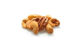 Yupik Deluxe nut mix spilling from a scoop, ideal for salads and baking.