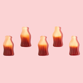 Yupik Gummy Cola Bottles close-up texture, soft and chewy candy.