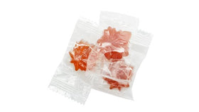 Close-up of individual wrappers highlights premium maple flavor and bite-sized snack appeal.