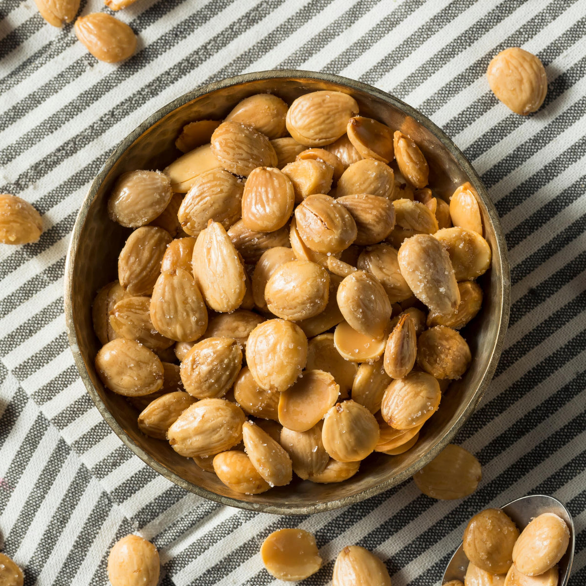 Flat, wide Yupik marcona almonds highlighting premium texture.