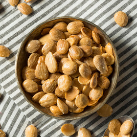 Flat, wide Yupik marcona almonds highlighting premium texture.