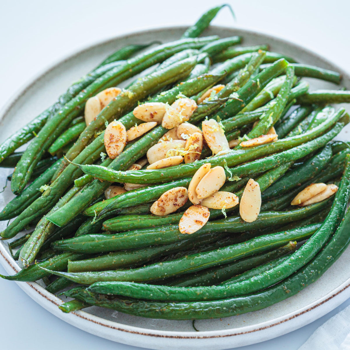 Yupik marcona almonds sprinkled on a fresh salad as a crunchy topping.