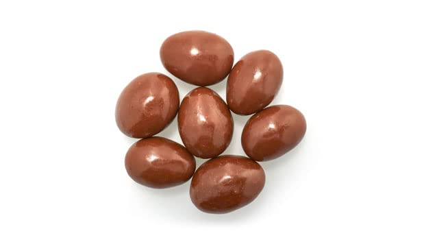 Yupik milk chocolate coated almonds with glossy finish, rich and smooth texture for snacking.