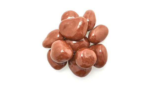 Yupik milk chocolate covered cranberries closeup, smooth chewy texture for snacking