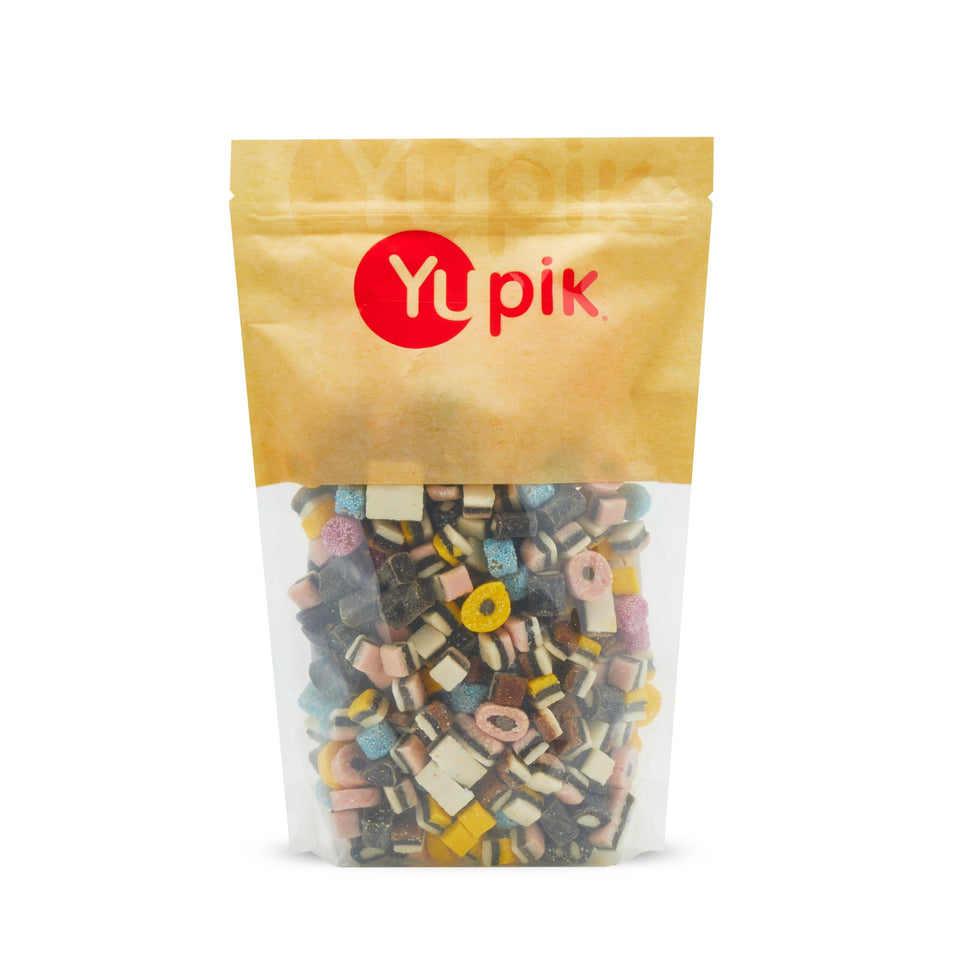 Yupik mini licorice candies assortment on a plate; a colorful snack for gatherings.