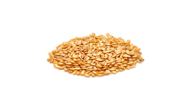 Ground Yupik golden flax seeds on the counter, ideal for baking and thickening.