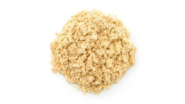Yupik Organic Ground Tigernuts Powder on a mixing bowl, perfect for gluten-free baking.