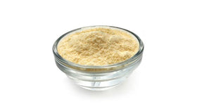 Yupik millet flour pouring into bowl for gluten-free cooking