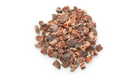 Yupik Organic Raw Cacao Nibs closeup—rich texture perfect for toppings.