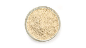 Yupik Organic Sorghum Flour being measured for gluten-free batter.