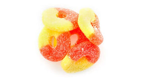 Close-up of chewy Yupik Peach Rings with a sugary coating for snacking