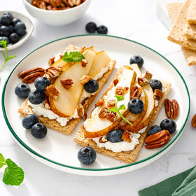 Yupik pecans halves on a baking sheet, suitable for roasting.
