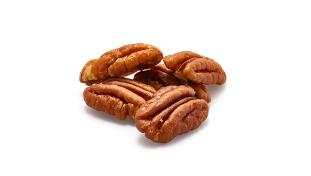 Yupik pecans halves sprinkled on salad for fiber-rich topping.