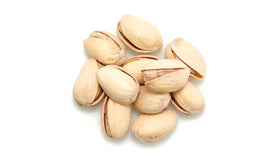Yupik pistachios in-shell handful, ready-to-eat on-the-go snack.