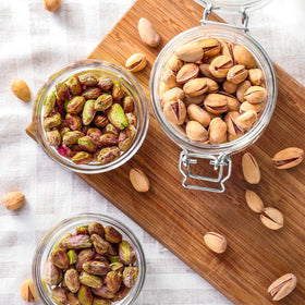 Yupik pistachios on white background, gluten-free and kosher certified.