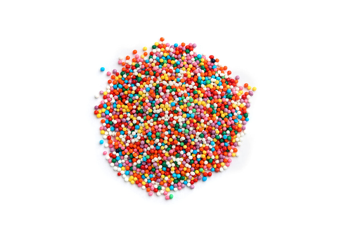 Yupik rainbow nonpareils close-up showing tiny colorful dots for decorating.