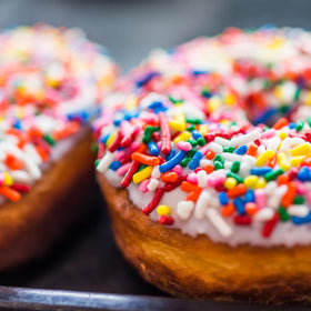 Yupik Rainbow Sprinkles on donuts provides bright topping for treats.