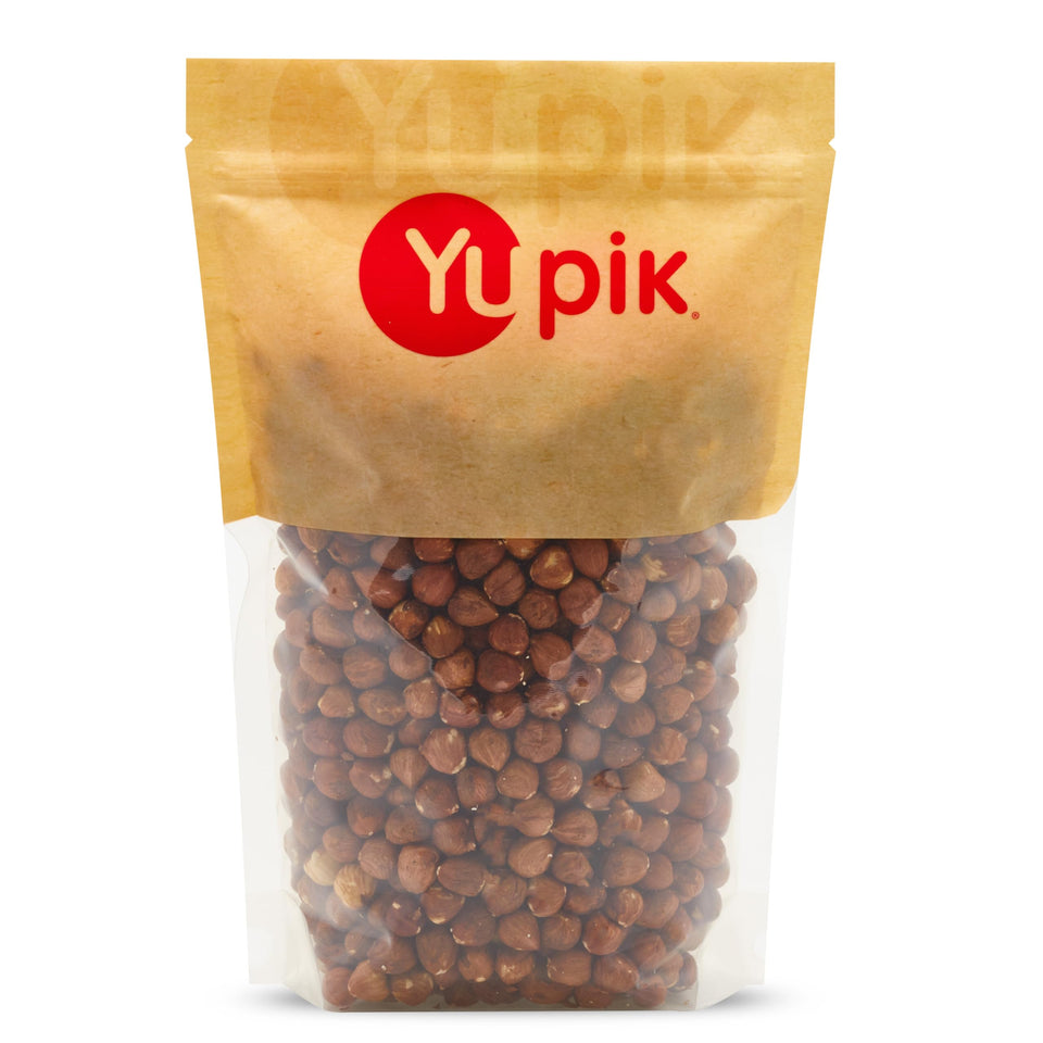 Yupik raw hazelnuts with skin in a bag, ideal for snacking and baking.