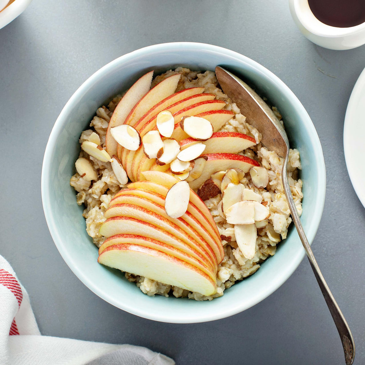Yupik Organic Regular Rolled Oats cooking in a bowl with milk