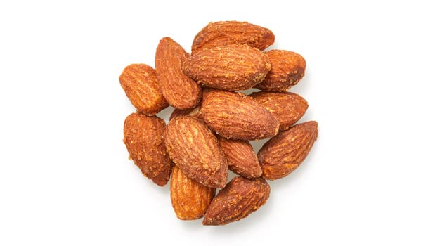 Close-up of Yupik Smoked Almonds in a bag highlighting roasted, salted texture.