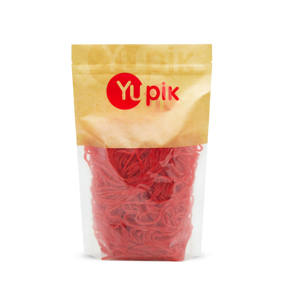 Yupik Strawberry Licorice Laces show long strands, perfect for sharing and snacking.