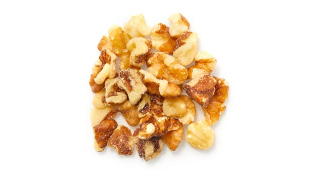 Close-up of halved and quartered Yupik walnuts ready for cooking
