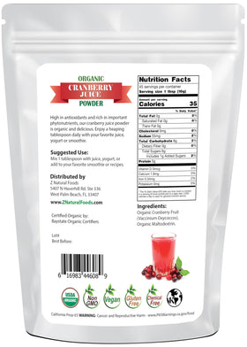 Z Natural Foods Cranberry Powder scoop beside a glass of juice