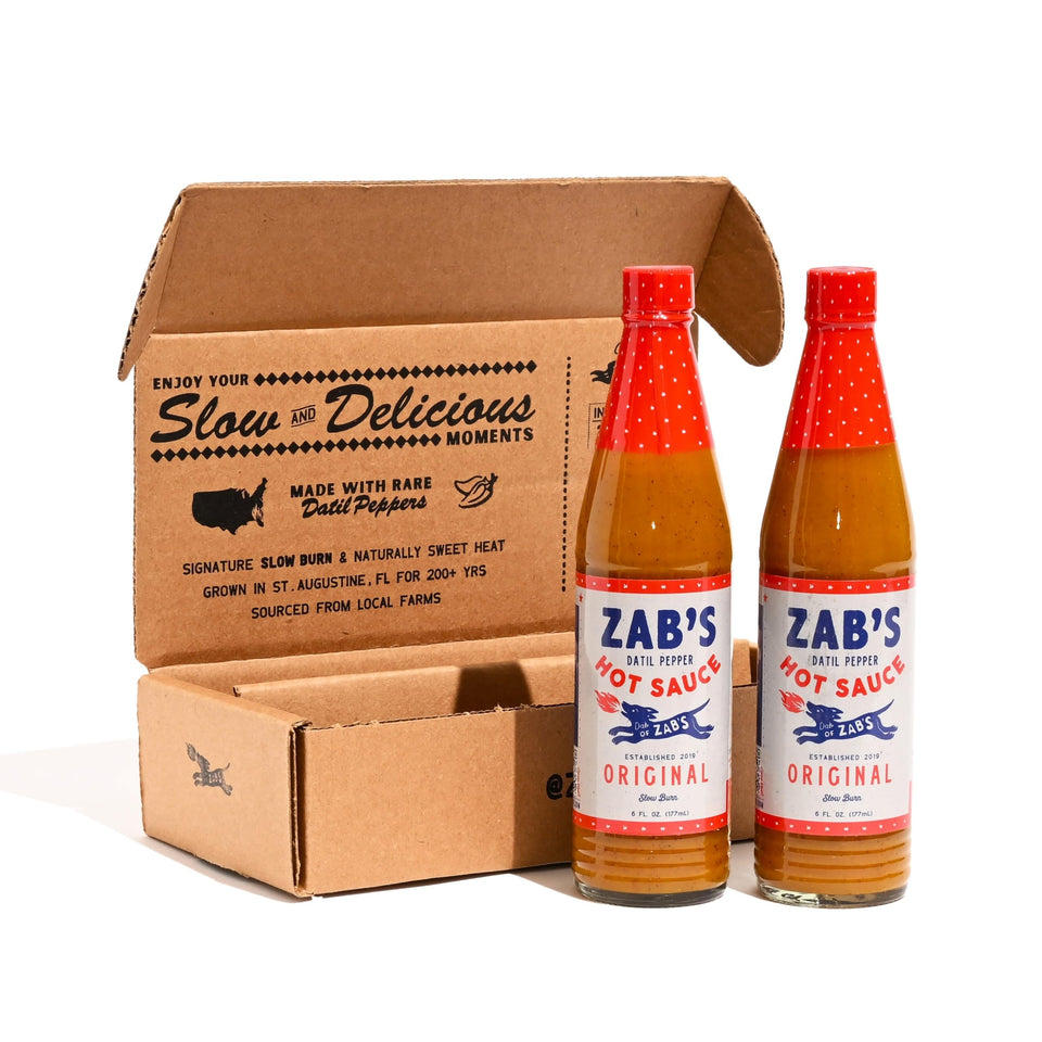 Zab's Gift Set packaging highlights the brand and premium hot sauce duo for gifting.