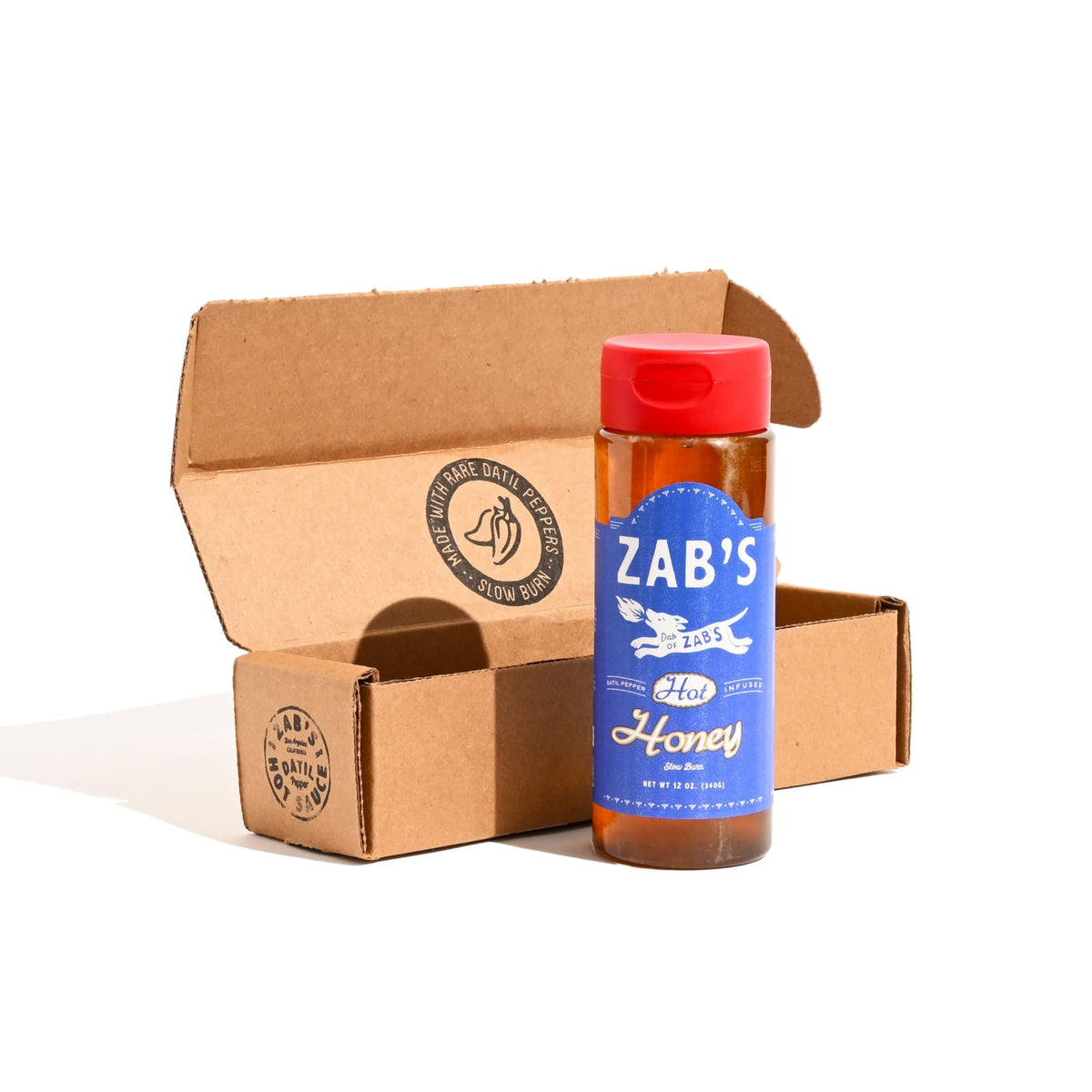 Zab's Hot Honey bottle shows datil peppers drizzle for bold, floral flavor.