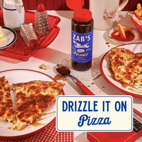 Zab's Hot Honey on a counter invites drizzle over snacks.