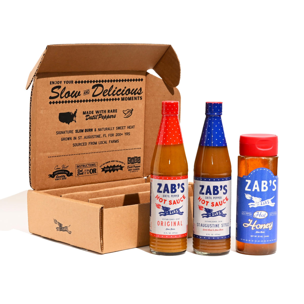 Zab's hot sauce gift set bottles displayed for gifting and tasting variety.