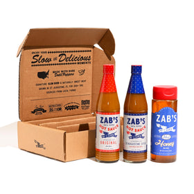 Zab's hot sauce gift set bottles displayed for gifting and tasting variety.