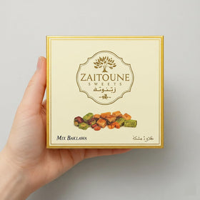 Zaitoune baklava close-up with pistachios and flaky pastry, premium quality.