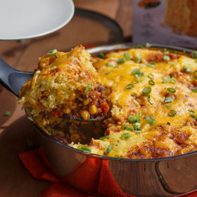 Sliced cornbread served warm pairs well with beans and gumbo.