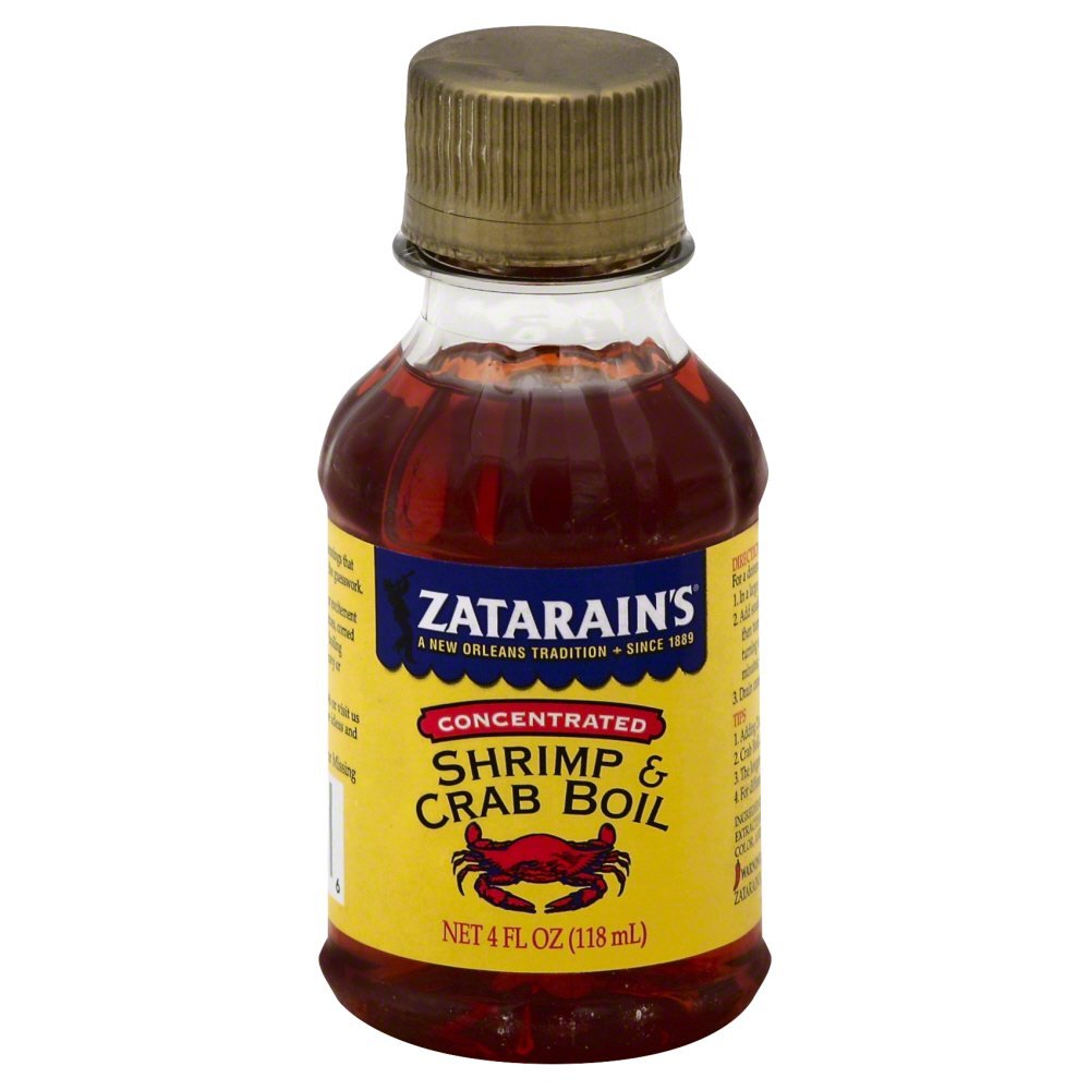 Zatarain's bottle being poured for bold seafood flavor during boiling.