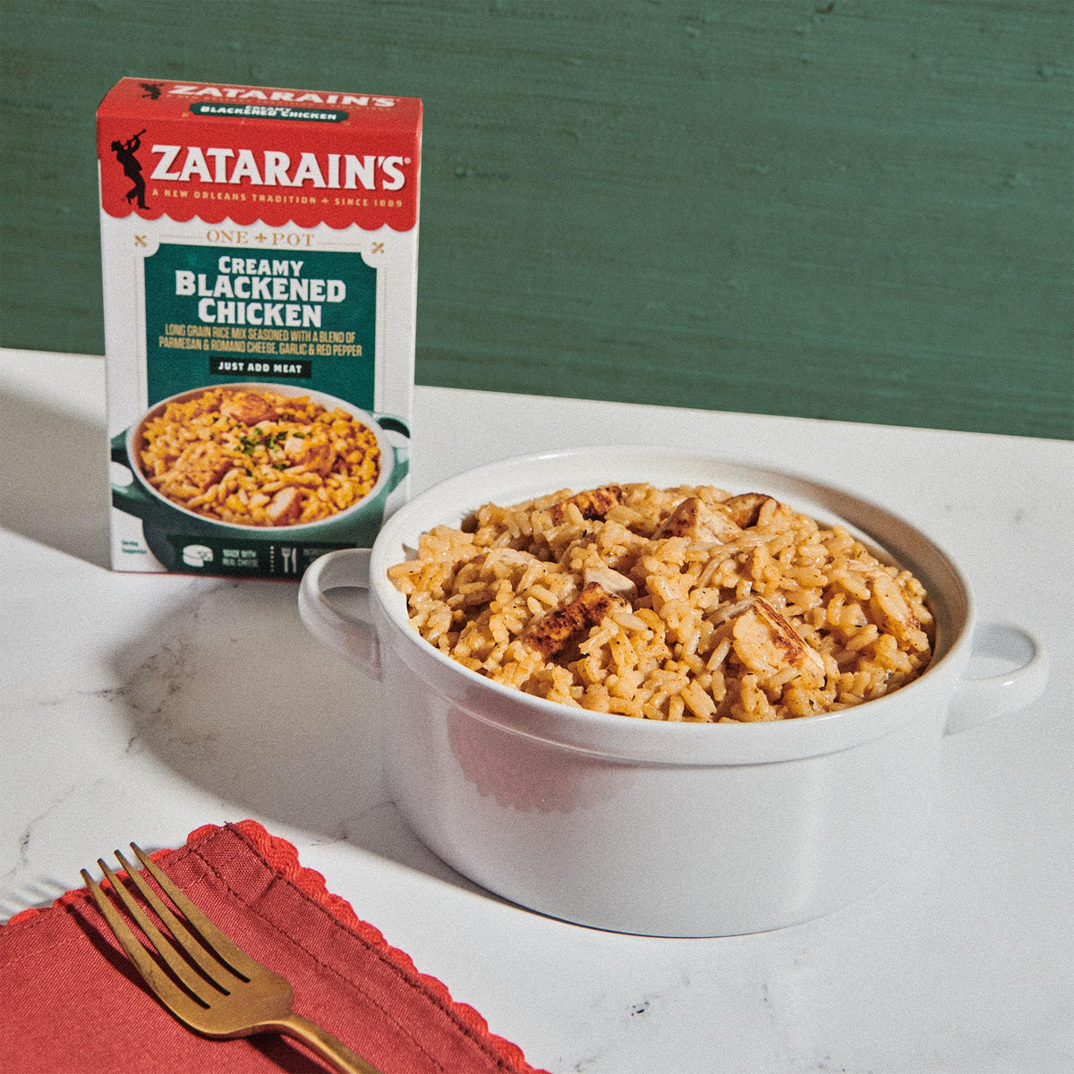 Zatarain's Creamy Blackened Chicken Rice Mix simmering pot on stovetop