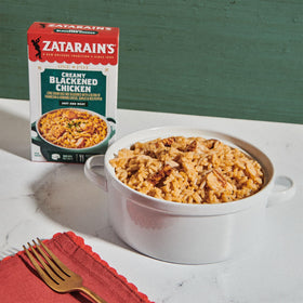 Zatarain's Creamy Blackened Chicken Rice Mix simmering pot on stovetop