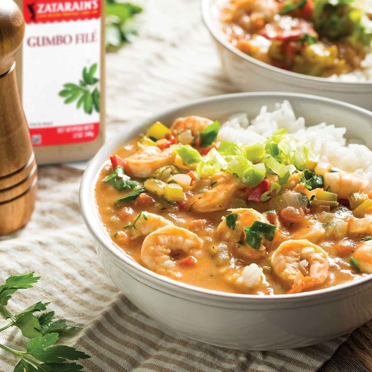 Zatarain's Gumbo Filé kitchen scene showing versatile flavor booster.