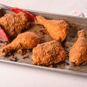 Dredging chicken in Zatarain's mix ready for a quick, flavorful fry.