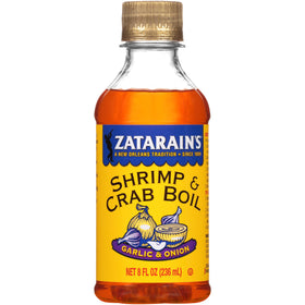 Zatarain's liquid shrimp boil bottle ready for seafood boils with bold garlic and onion flavor.
