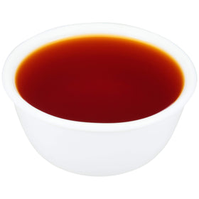 Zatarain's concentrated boil bottle with spoon demonstrates chef-friendly portioning