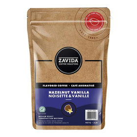 Zavida hazelnut vanilla whole bean coffee bag preserves freshness with resealable zipper and valve.