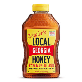 ZEIGLER'S Georgia honey 32 oz squeeze bottle pouring smoothly into tea.
