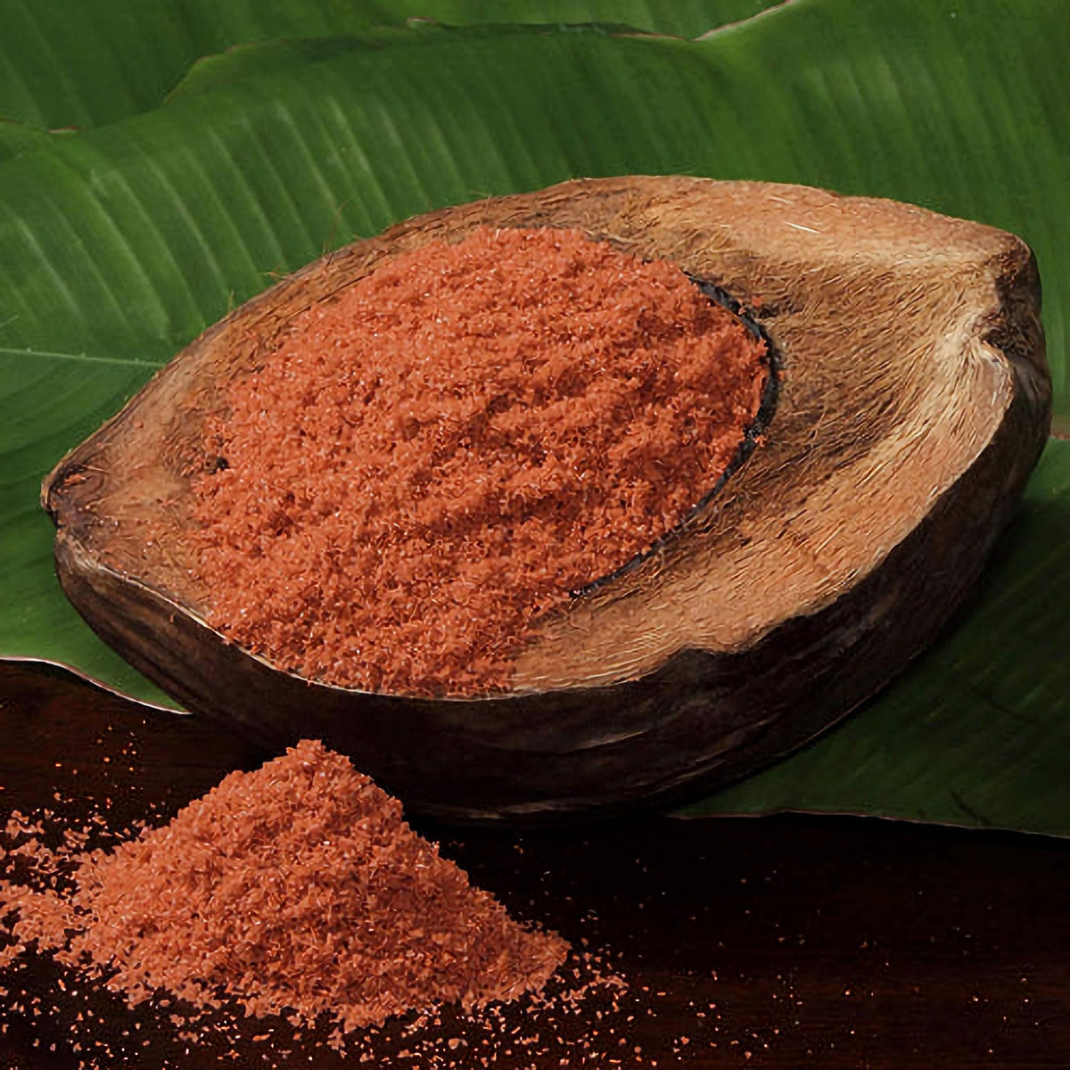 Zero Gravity Hawaii alaea salt granules close-up highlighting red clay infusion for vibrant finishing.