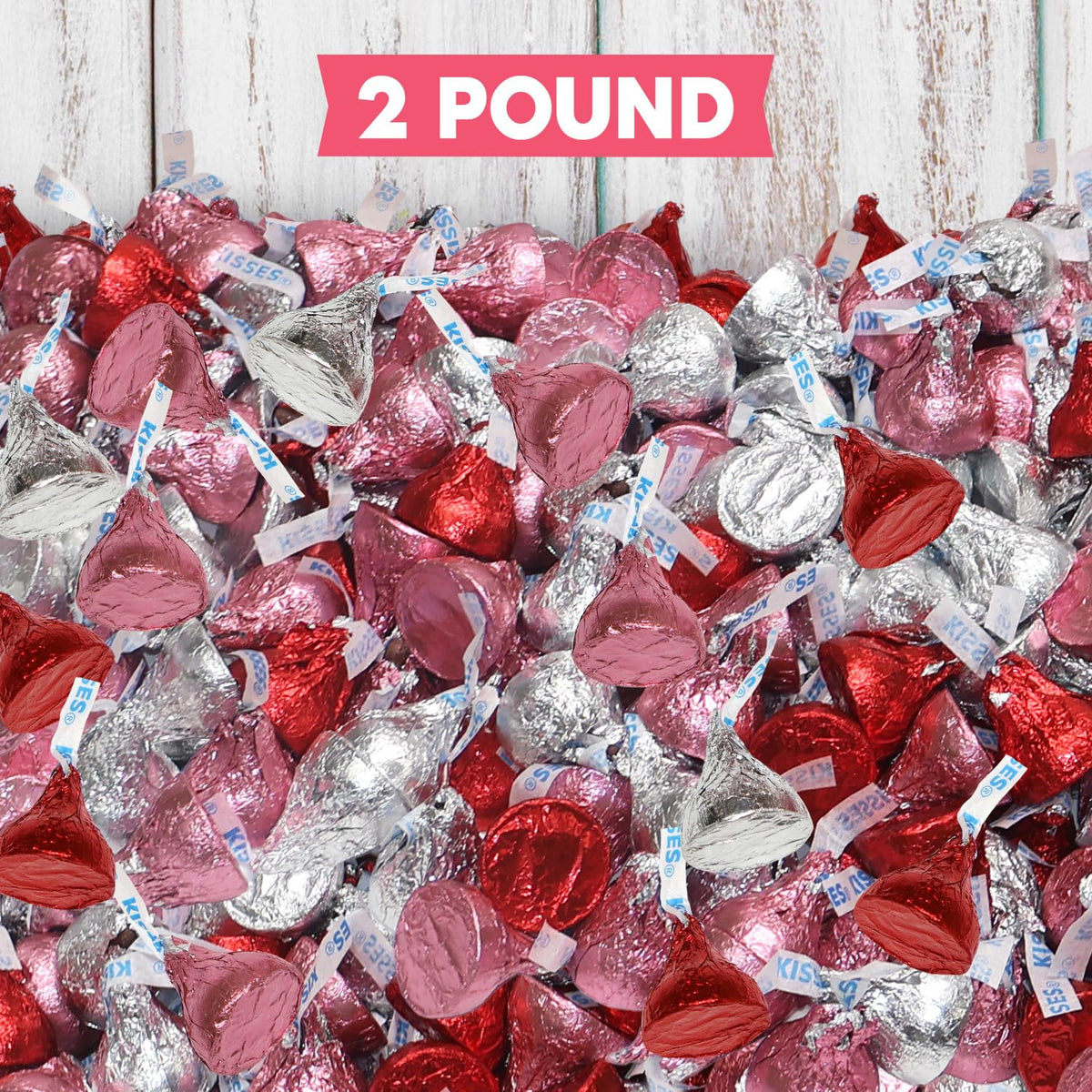 Zisbers Valentines Kisses wrapped treats on dessert table for party snacking.